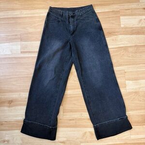 dark wash baggy low-mid rise wide-leg jeans with contrasting black cuffs